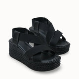 Loventino Kadın Yüksek Topuklu Sandalet 0012460 Siyah, modern tasarımı ve vegan deri kullanımıyla şıklığı ve konforu bir arada sunan lüks yaz modası parçasıdır.
